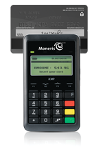 Swiping a credit or debit card through the magnetic stripe reader at the top of hte PAYD PIN Pad.